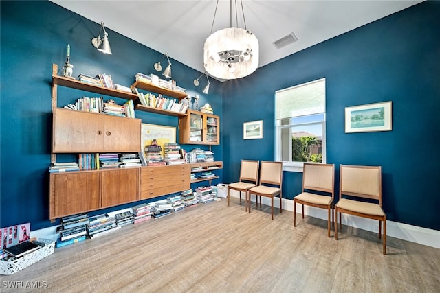 sitting room featuring hardwood / wood-style floors