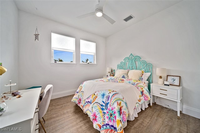 bedroom featuring dark hardwood / wood-style flooring and ceiling fan