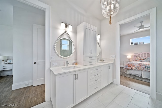 bathroom featuring a wealth of natural light, vanity, and hardwood / wood-style flooring