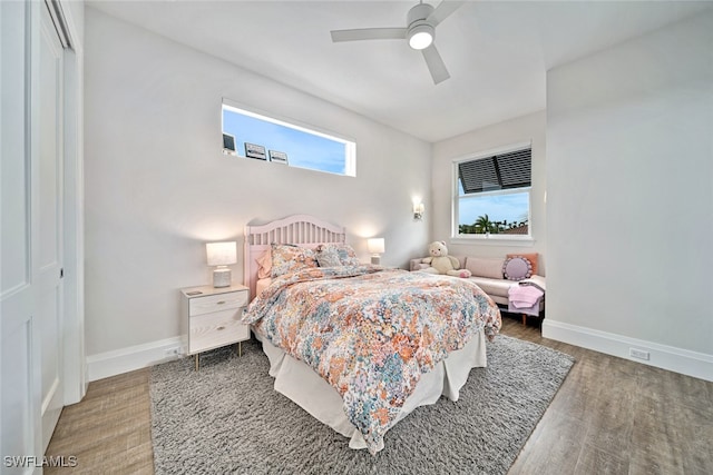 bedroom featuring ceiling fan, wood-type flooring, and a closet