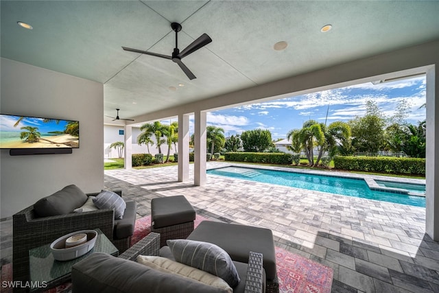 view of pool with a patio area, outdoor lounge area, and ceiling fan