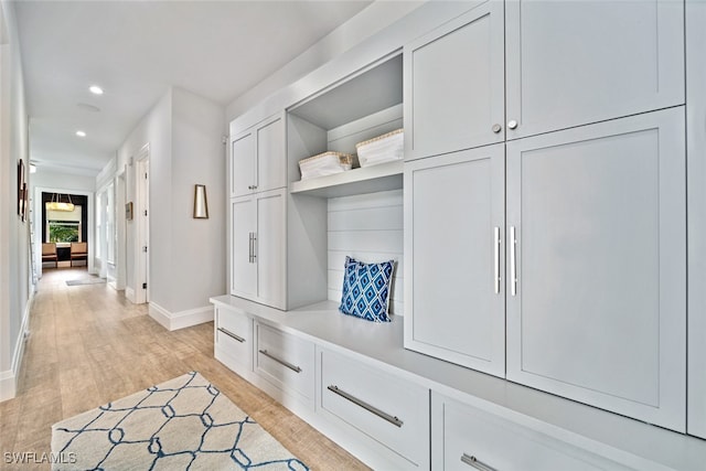 mudroom with light hardwood / wood-style floors