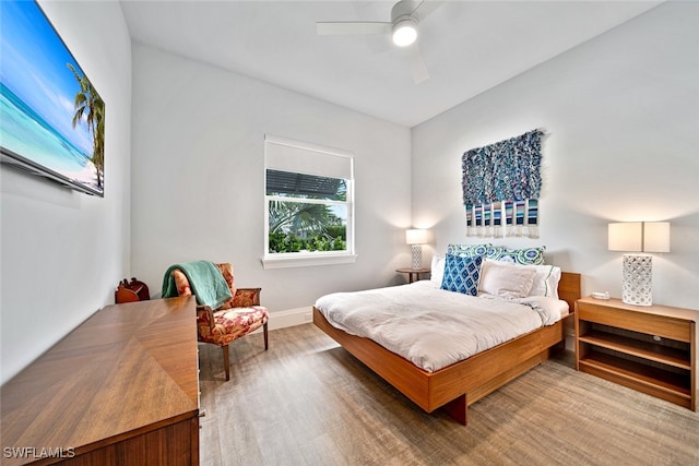 bedroom featuring wood-type flooring and ceiling fan