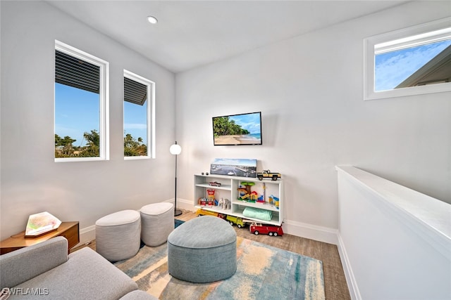 interior space featuring hardwood / wood-style flooring and a healthy amount of sunlight