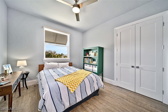 bedroom featuring a closet, ceiling fan, and light hardwood / wood-style flooring