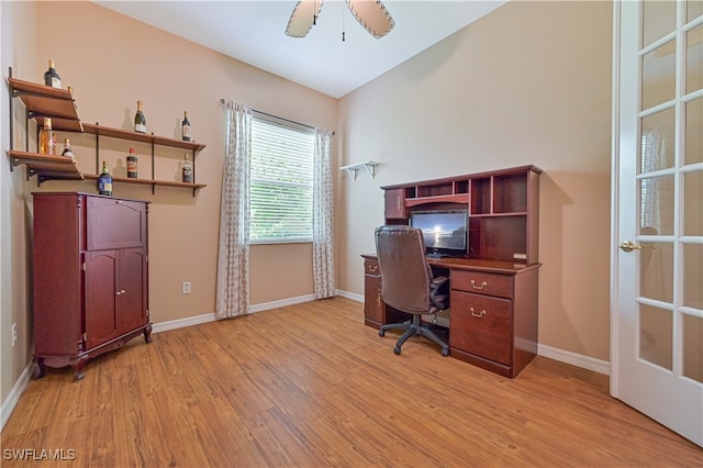 office with light wood-type flooring