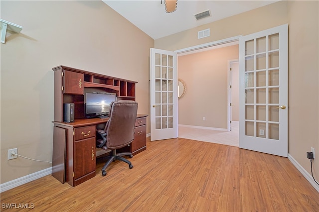 office space with light hardwood / wood-style floors and french doors