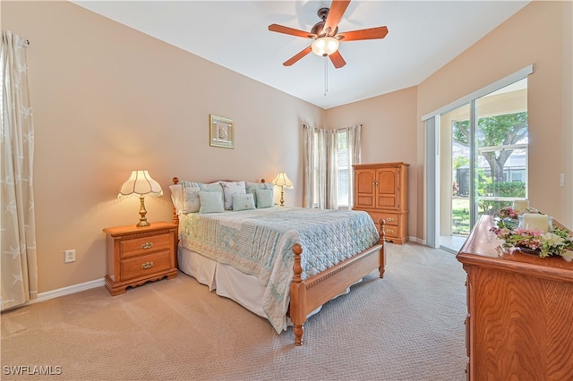 bedroom featuring ceiling fan and light carpet