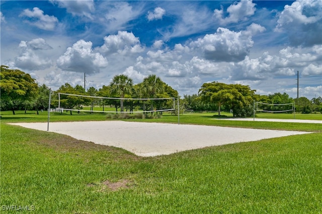 view of community with a yard and volleyball court