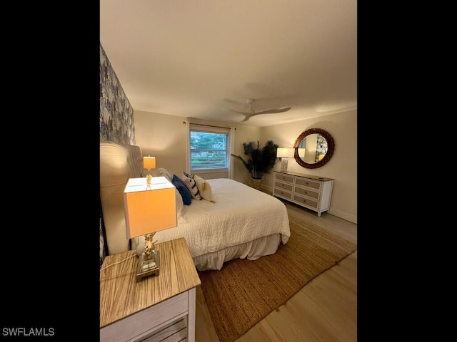 bedroom with hardwood / wood-style floors and ceiling fan