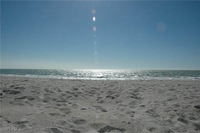 property view of water featuring a beach view