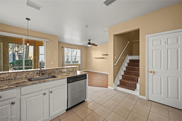 kitchen featuring ceiling fan with notable chandelier, sink, decorative light fixtures, dishwasher, and white cabinetry