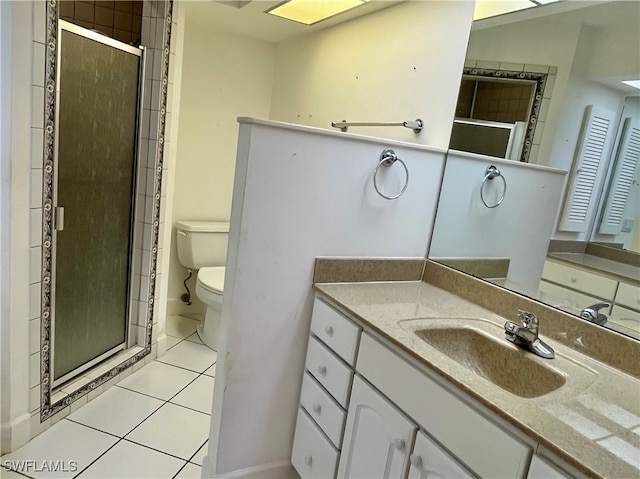 bathroom featuring toilet, walk in shower, vanity, and tile patterned floors