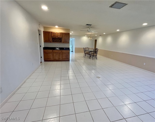 kitchen with ceiling fan and light tile patterned flooring