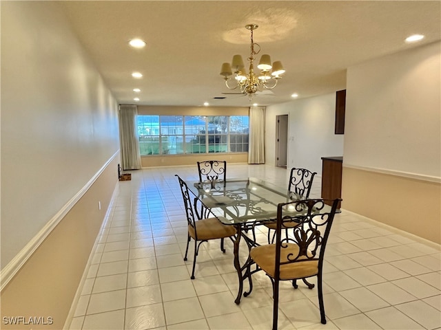 dining space featuring a chandelier and light tile patterned floors