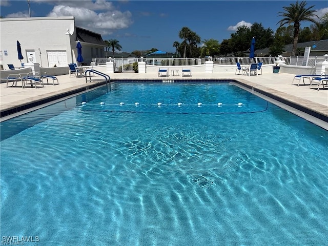 view of swimming pool with a patio area