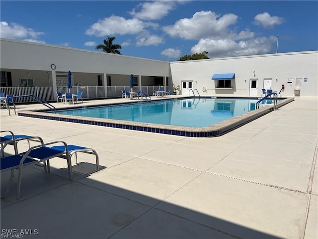 view of swimming pool with a patio area