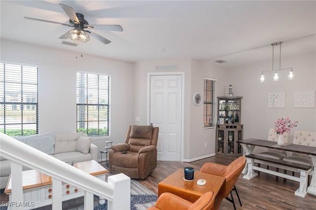 living room featuring ceiling fan and hardwood / wood-style floors