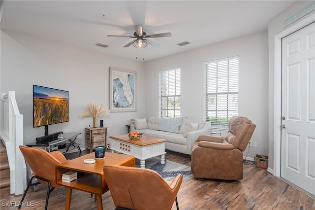 living room with hardwood / wood-style floors and ceiling fan