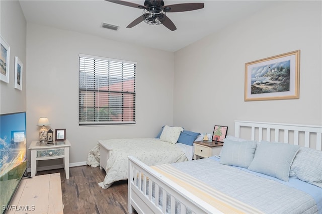 bedroom featuring dark hardwood / wood-style floors and ceiling fan