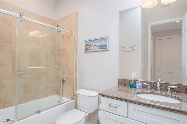 full bathroom with toilet, vanity, and combined bath / shower with glass door