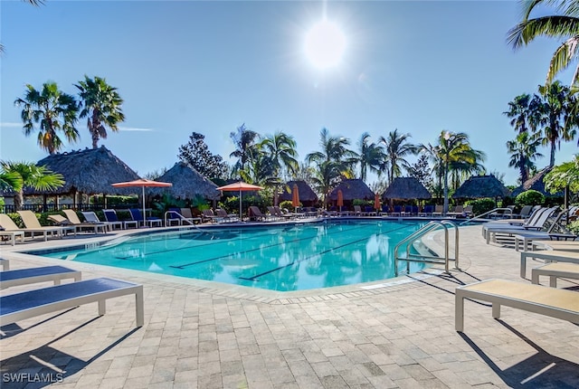 view of pool with a mountain view and a patio