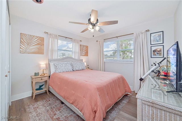 bedroom featuring hardwood / wood-style floors and ceiling fan