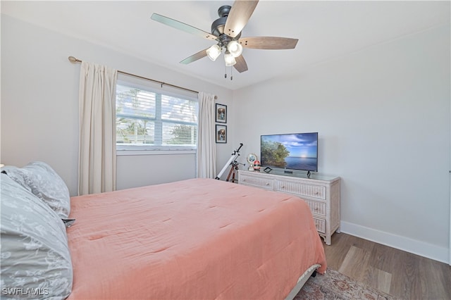 bedroom featuring hardwood / wood-style floors and ceiling fan