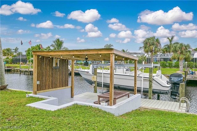 view of dock featuring a yard and a water view