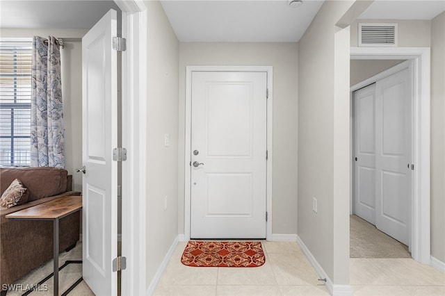 interior space with light tile patterned floors