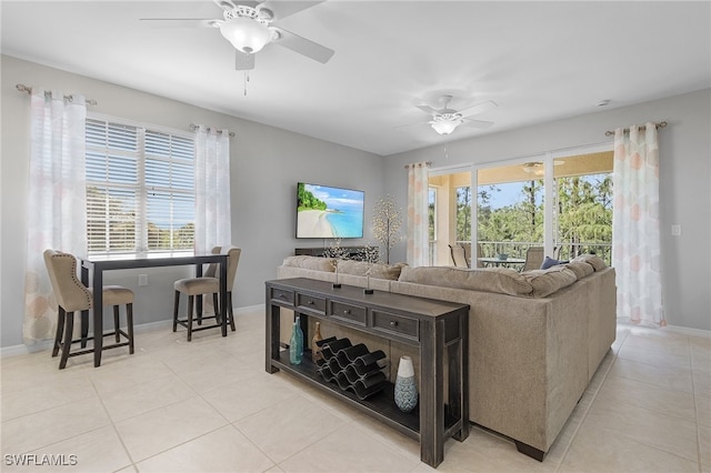 living room with light tile patterned floors and ceiling fan