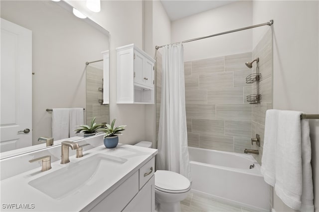 full bathroom with vanity, shower / bath combo, and toilet