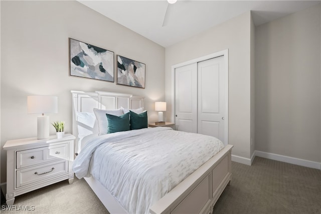 bedroom with ceiling fan, a closet, and dark colored carpet