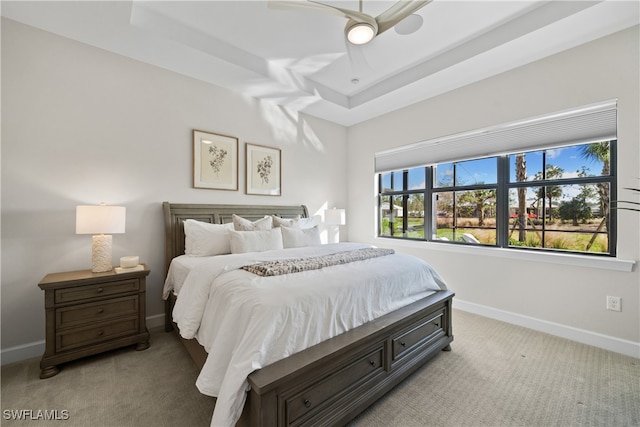 bedroom featuring ceiling fan and light carpet