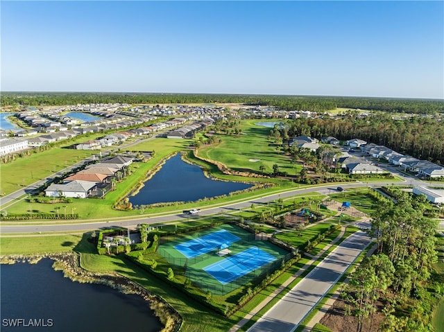 birds eye view of property with a water view