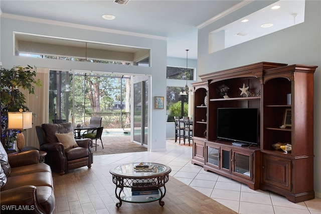 living room featuring light tile patterned floors and crown molding