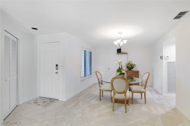 2233 Anchorage Ln Unit B, Naples, FL 34104 - dining area with a chandelier, baseboards, and light colored carpet