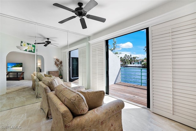2233 Anchorage Ln Unit B, Naples, FL 34104 - living area with arched walkways and ceiling fan
