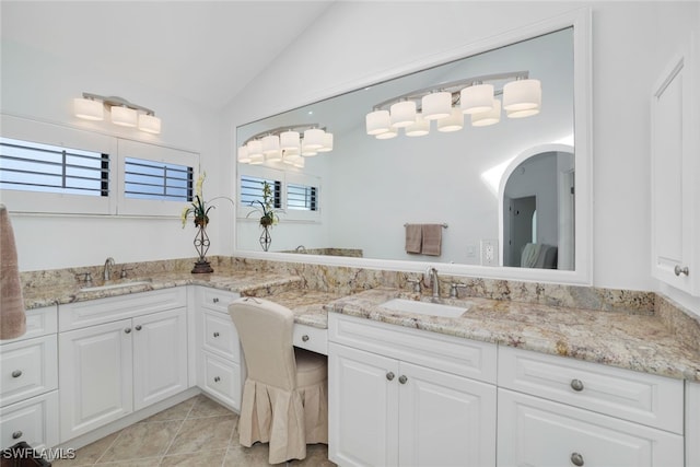 2233 Anchorage Ln Unit B, Naples, FL 34104 - bathroom with vaulted ceiling, vanity, healthy amount of natural light, and tile patterned flooring