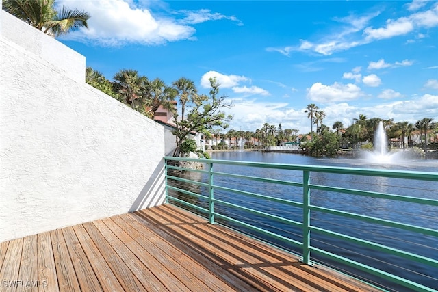 wooden deck featuring a water view