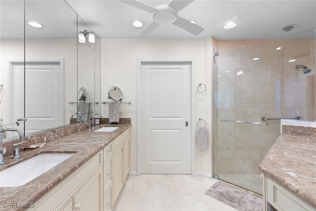 bathroom featuring an enclosed shower, vanity, and ceiling fan