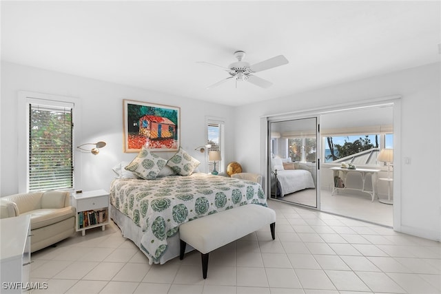 tiled bedroom with ceiling fan