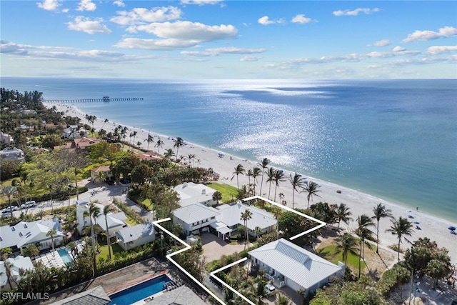 birds eye view of property with a beach view and a water view