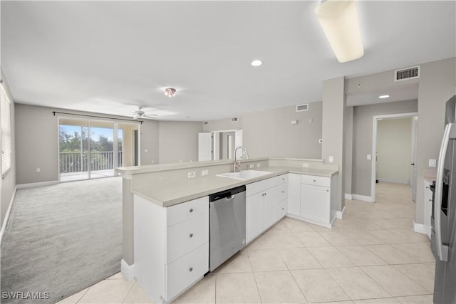 kitchen with white cabinetry, sink, stainless steel dishwasher, kitchen peninsula, and light colored carpet