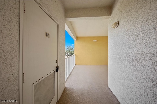 hallway with light carpet