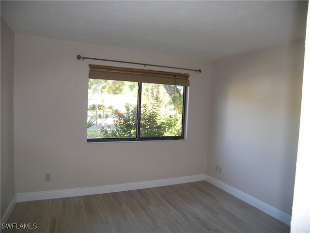 spare room with light hardwood / wood-style floors