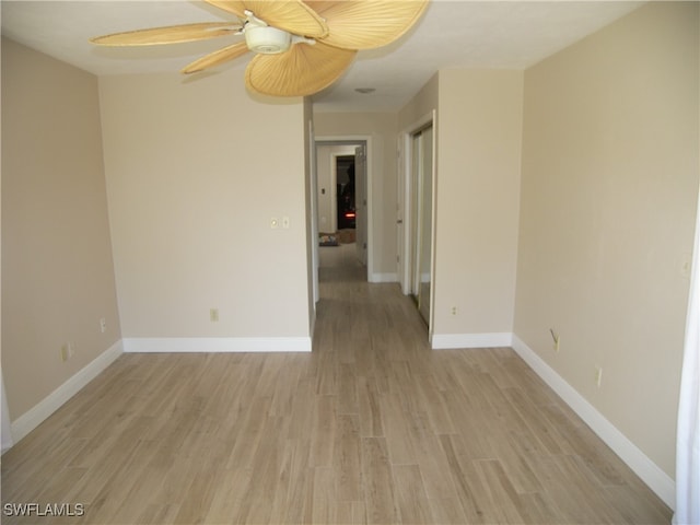 spare room with ceiling fan and light hardwood / wood-style floors