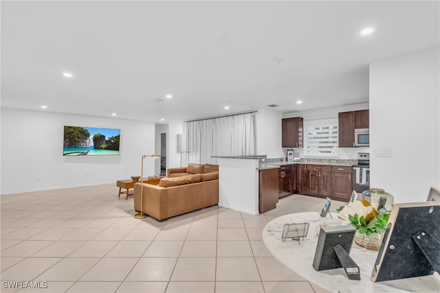 living room with light tile patterned floors