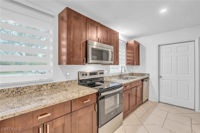 kitchen with sink, stainless steel appliances, and plenty of natural light