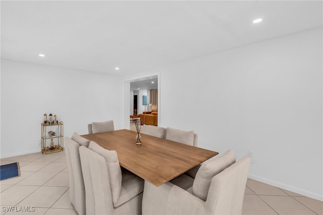 dining room with light tile patterned flooring